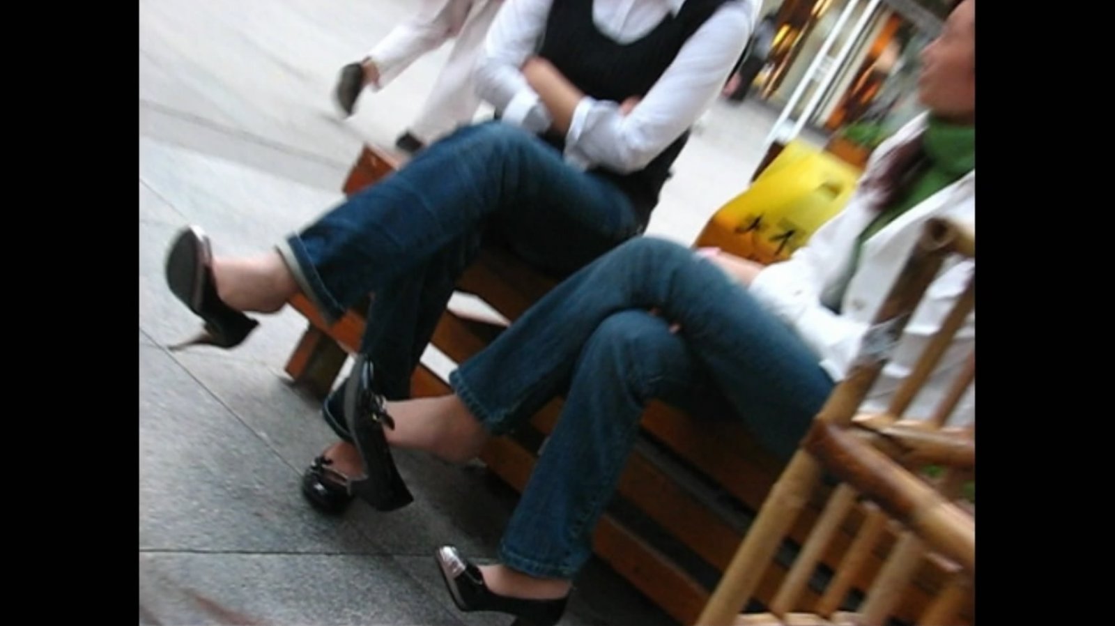 Wooden benches and dangling legs